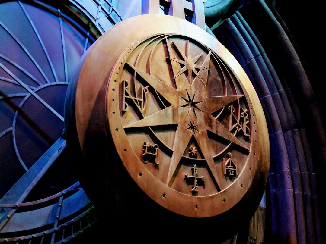 a close up of a clock on a building a close up of a clock on a building